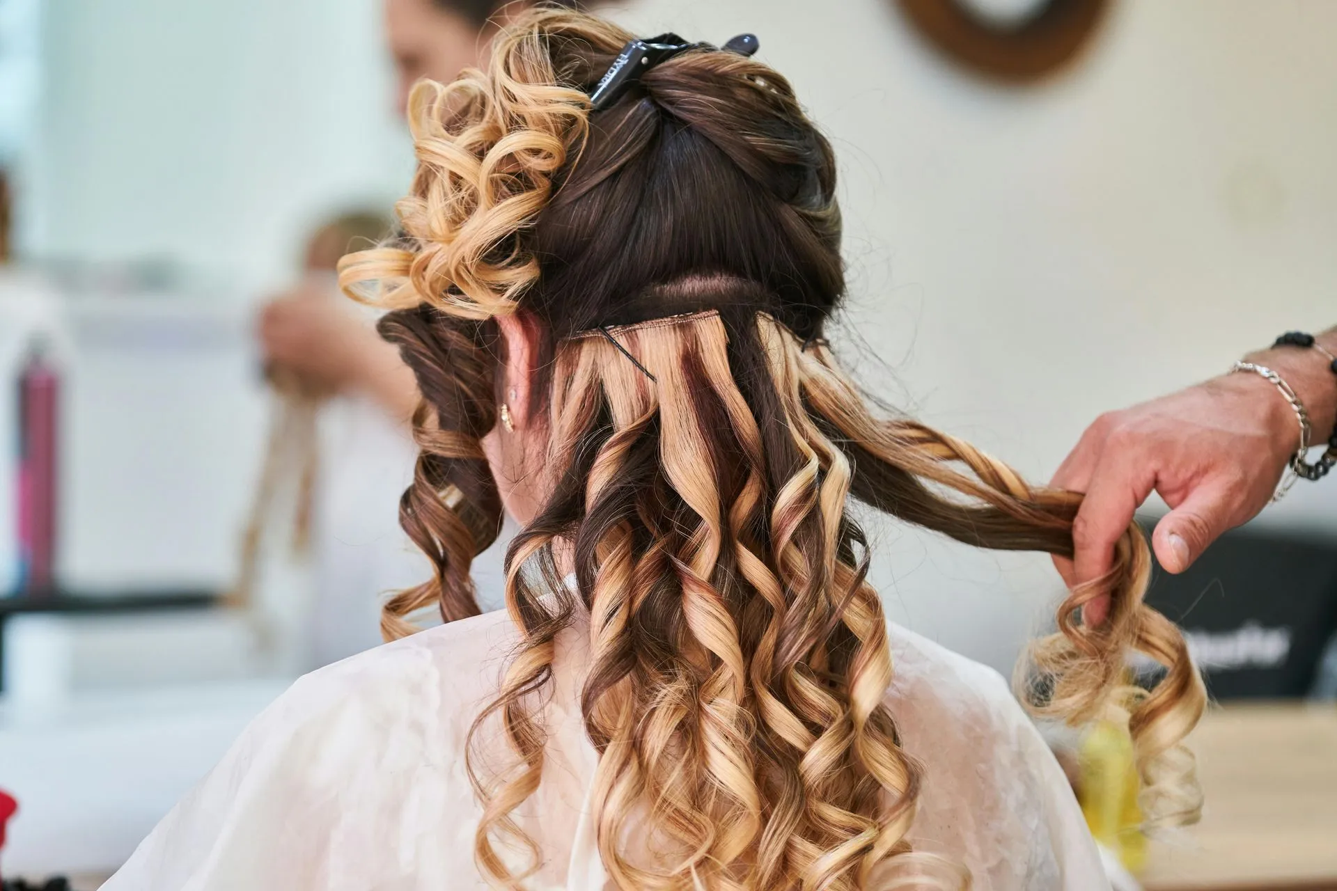 Hair being styled in a professional salon